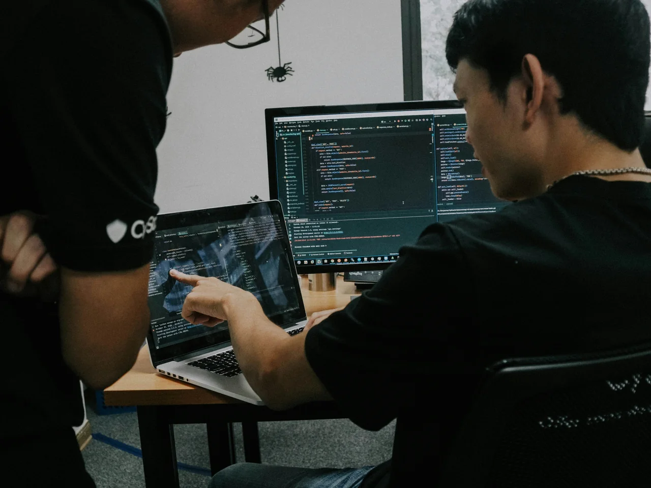 Two developers reviewing application code together